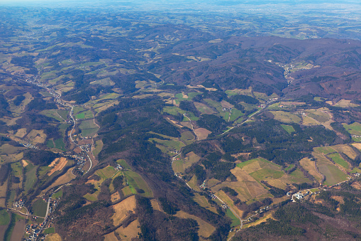 Rolling hills view from above . Flying over awesome natural landscape . Flight over Switzerland