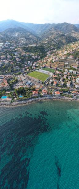 istock Football field next to beach 1411612752