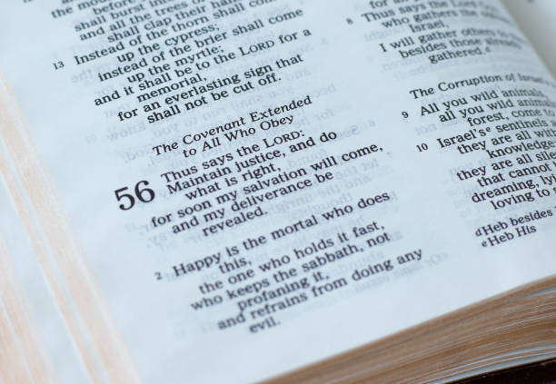 istock Open Holy Bible Book prophet Isaiah 56, God's covenant for all who obey His commandments 1411613410