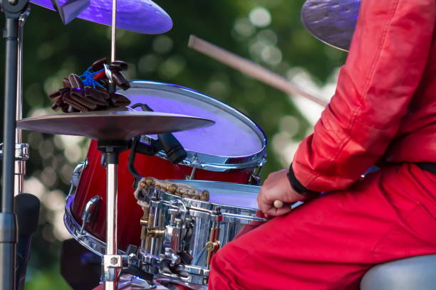 istock Drummer plays drums at open air festival (no face) 1411614464