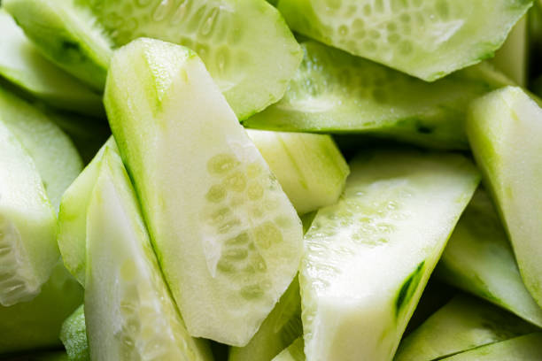 istock Fresh cucumbers on wooden table 1411616250
