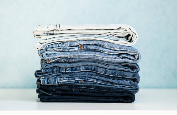 istock Some stacked blue jeans, close up. Denim collection. 1411618139
