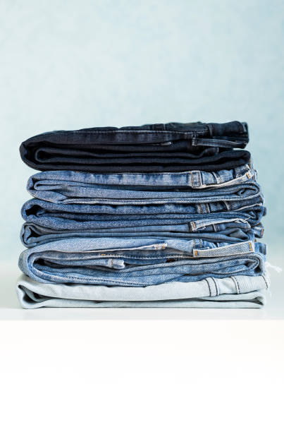 istock Some stacked blue jeans, close up. Denim collection. 1411618150