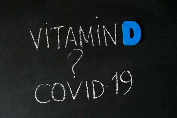 istock Vitamin D help in treating coronavirus. Vitamin D, coronavirus and question mark drawing on chalkboard 1411619567