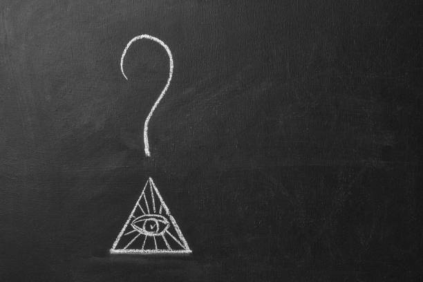 istock Question mark over masons symbol on chalk board. 1411619640