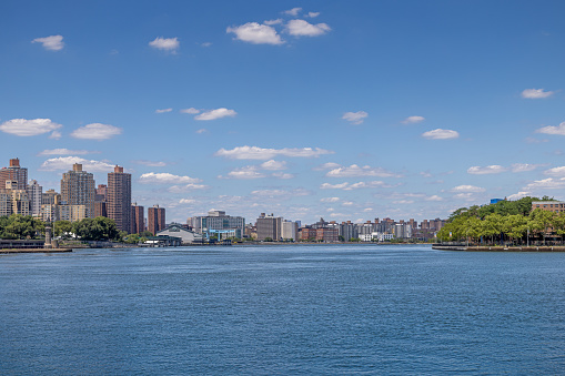 View over East River towards Manhattan from Socrates Sculpture Park in Long Island City which is a part of Queens and is a mixture of new and old, small industries and residential areas close to Manhattan, New York