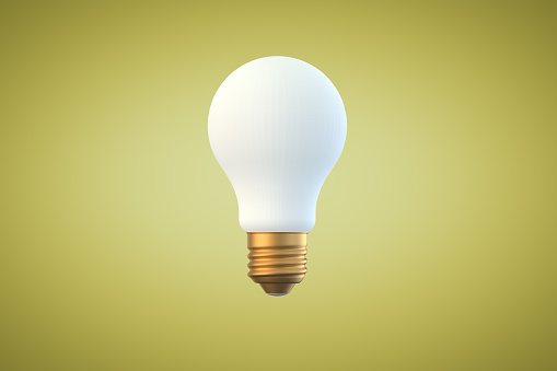 A light bulb on a yellow background