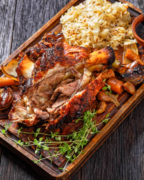 istock Crispy skin German Pork Knuckle with sauerkraut 1411625561
