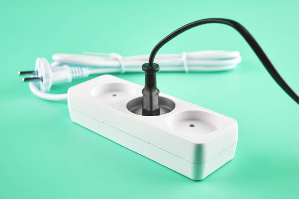 an electric extension cord with an electric plug plugged into it