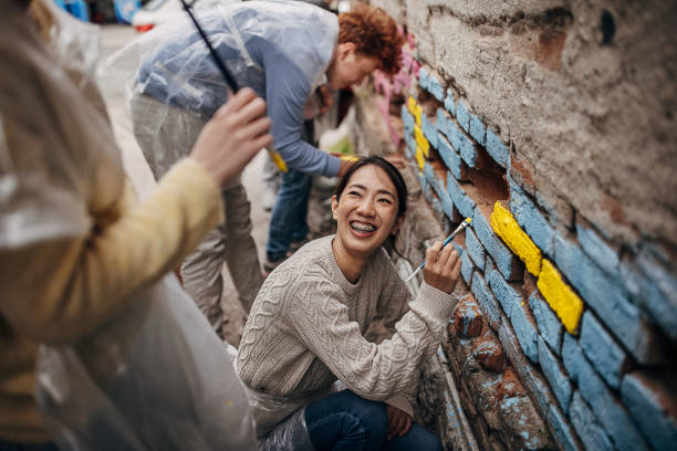 istock Street artists drawing on wall 1411627780