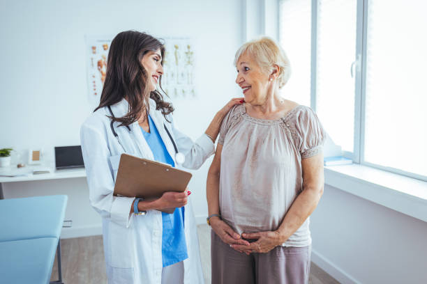 istock Doctor and patient standing in doctor's office 1411627891