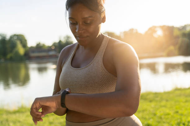 istock African American woman using smart watch during the training 1411629075