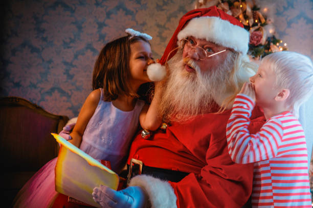 istock Santa Claus gives presents 1411632491