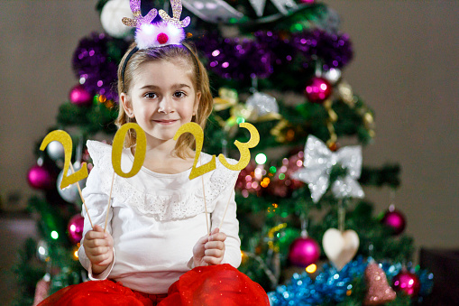 Small child celebrate Christmas and new year