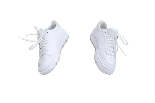 istock Casual, stylish, white sneakers isolated over white studio background. Trendy 1411635473