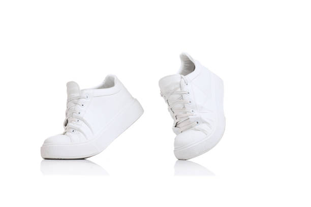 Casual, stylish, white sneakers isolated over white studio background. Comfortable footwear. Concept of fashion, comfort, style, shopping, casual. Copy space for ad, text and design