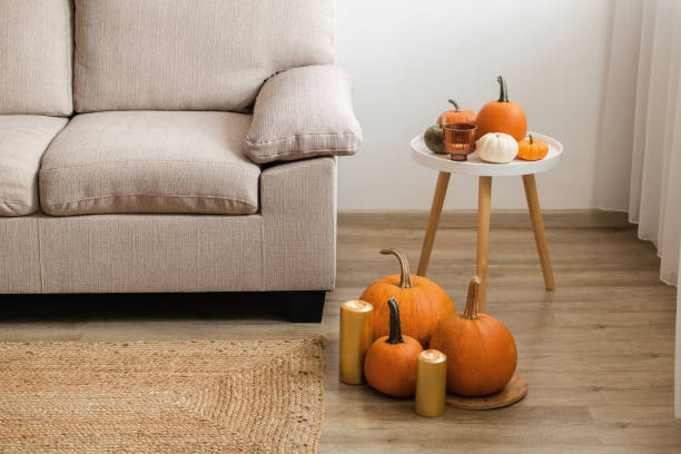 istock Room decorated with pumpkins and candles 1411635715