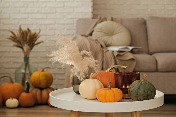 Room decorated with pumpkins and candles stock photo