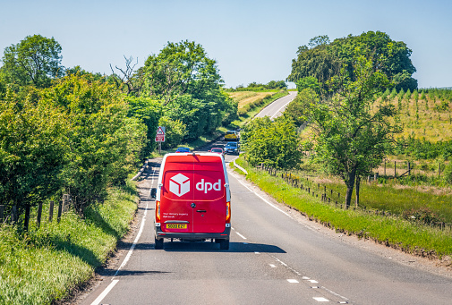 North Ayrshite, Scotland - Rear view of a DPD delivery van during a journey on a winding country road south of Glasgow.