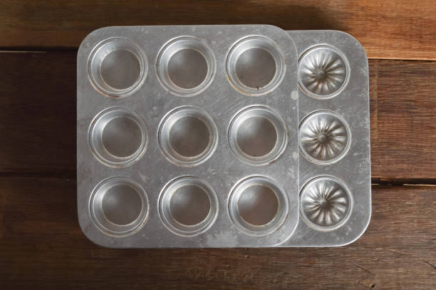 Aluminum cookie form baking shape isolated on a wooden background