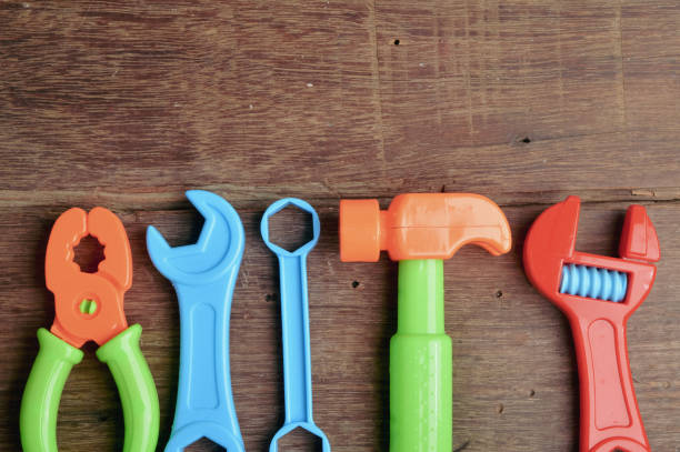 istock Top view of DIY tools set isolated on a wooden background. Copy space for the text. 1411644680