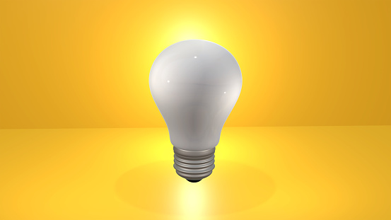 3D rendering of light bulb against yellow background
