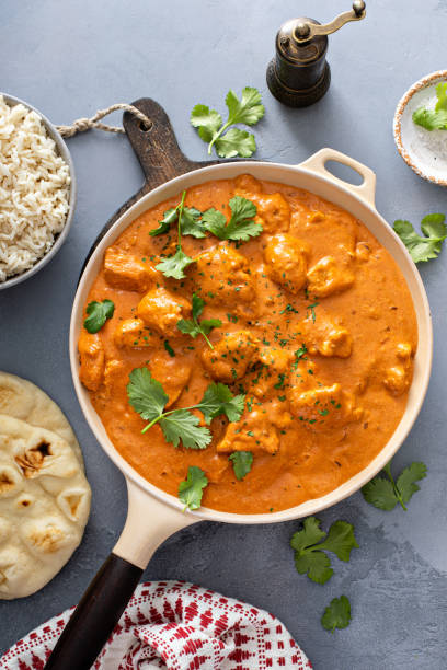istock Chicken tikka masala, cooked marinated chicken in spiced curry sauce 1411646698