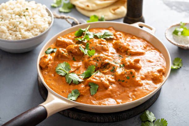 istock Chicken tikka masala, cooked marinated chicken in spiced curry sauce 1411646700