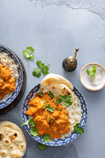 istock Chicken tikka masala, cooked marinated chicken in spiced curry sauce 1411646708