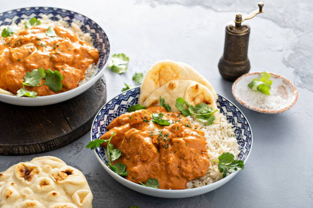 istock Chicken tikka masala, cooked marinated chicken in spiced curry sauce 1411646709