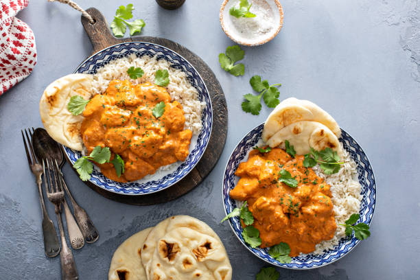 istock Chicken tikka masala, cooked marinated chicken in spiced curry sauce 1411646710