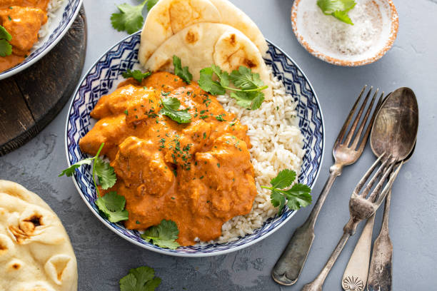 istock Chicken tikka masala, cooked marinated chicken in spiced curry sauce 1411646714