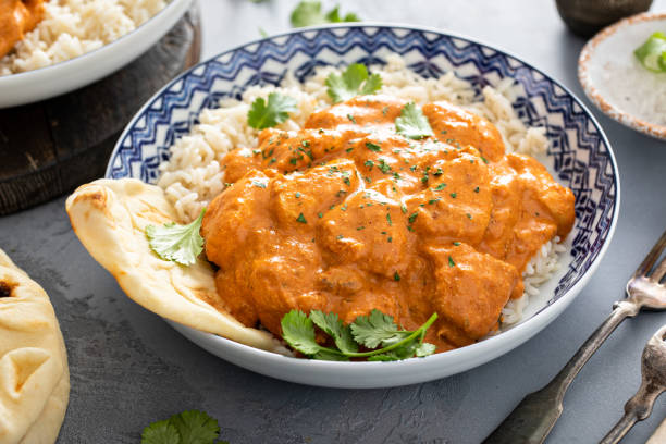 istock Chicken tikka masala, cooked marinated chicken in spiced curry sauce 1411646716