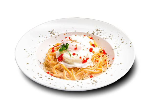 Poached Egg creamy spaghetti served in white bowl cut out white background high resolution stock photo
