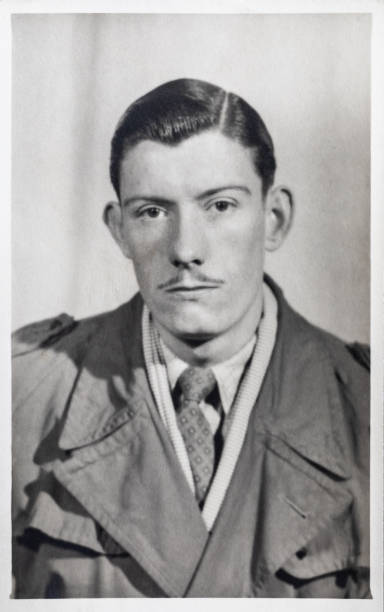 Young man with moustache, circa 1948. Black and white vintage photo of a man aged 20. stock photo