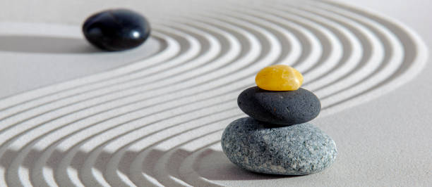 istock Japanese zen garden with stone and textured sand 1411656710