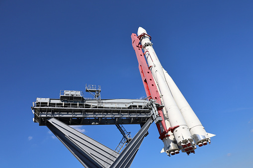 Moscow, Russia - July 2022: Russian spaceship Vostok 1, monument of the first soviet rocket at VDNH against blue sky