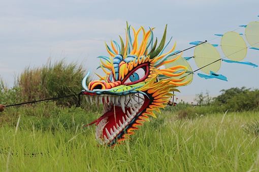 Probolinggo, Indonesia. The dragon kite is a long and large kite so that it takes a lot of people to fly it, usually it is flown on the beach. On December 26, 2021