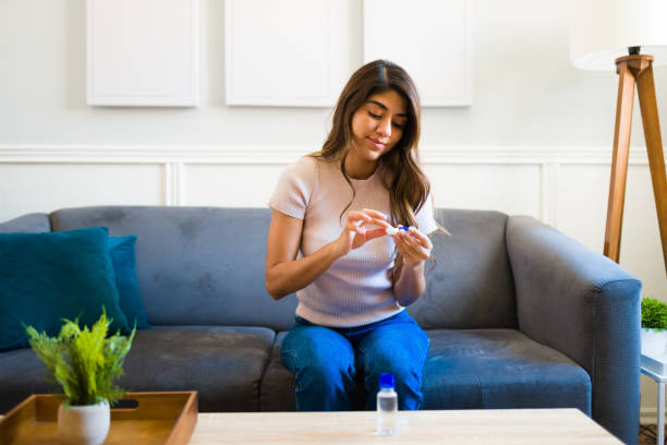 istock Attractive woman using contact lenses for a better vision 1411661915