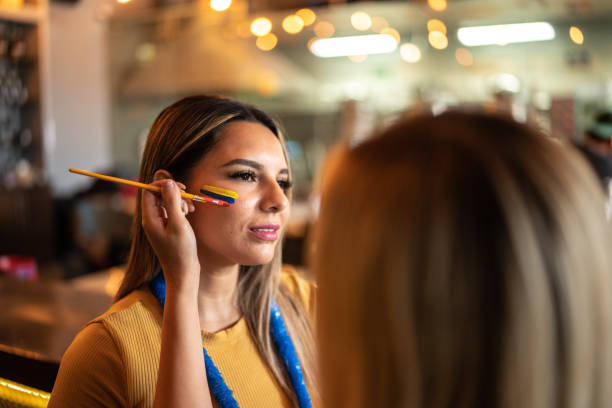 istock Friends painting a face at a bar 1411661945