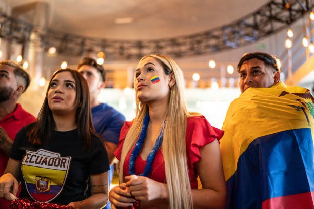 Ecuadorian friends watching a soccer game at a bar