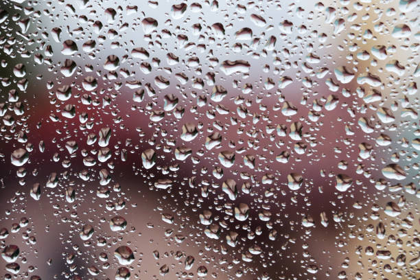 Rain drops on window , rainy day stock photo