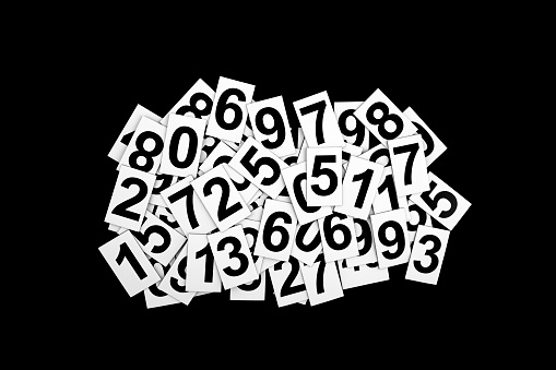 Abstract background with random numbers isolated on black background. Typography background composition.