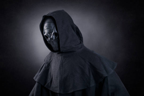 Mysterious humanoid alien at night over dark misty background