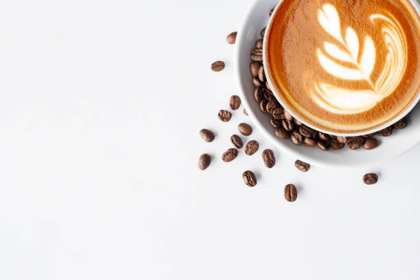 istock cup of coffee and bean on white table background. top view 1411669110