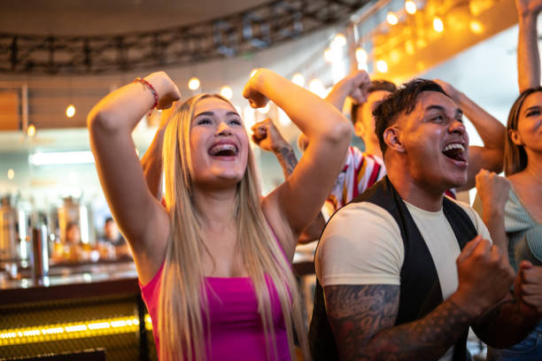 istock Friends watching and celebrating a sport match 1411671109