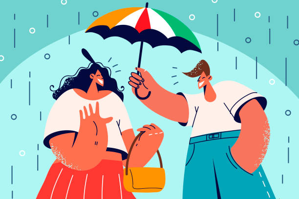 istock Smiling man cover woman with umbrella 1411674195