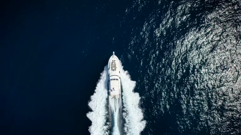 Aerial view of a yacht traveling with  speed