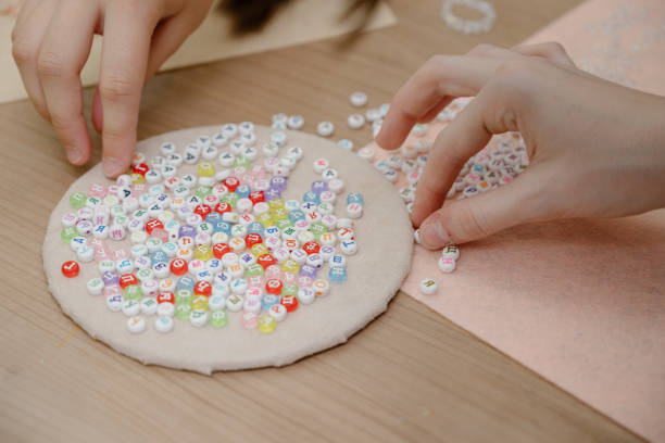 istock Jewelry making and beading process.Fashion, creativity and handmade concept 1411677775