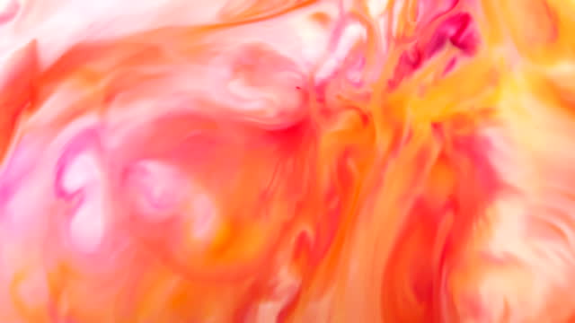 Abstract slow motion ink background Super vibrant colorful paint cosmic swirls and wave flowing forms